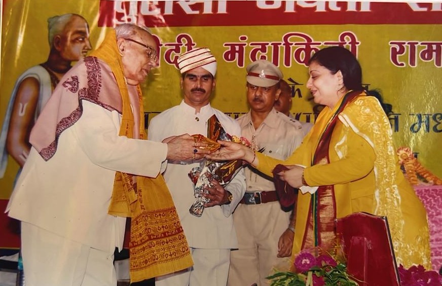 Felicitating an honoured guest at a commemorative function